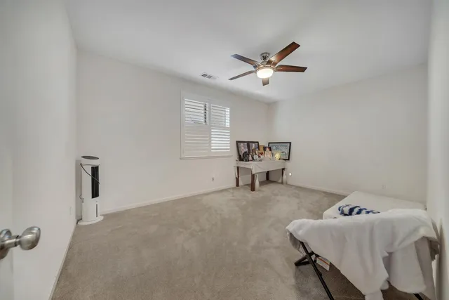 a spacious bathroom with a shower sink and a mirror