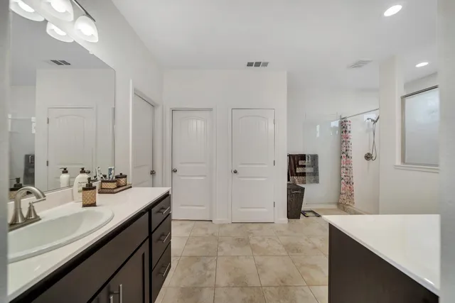 a view of a storage & utility room with a window