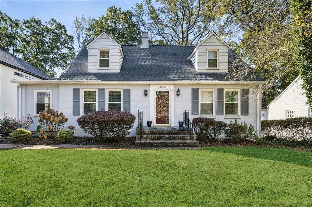 2050 Mercer Avenue Atlanta, GA 30337 - Photo 1 of 29 a front view of a house with a yard