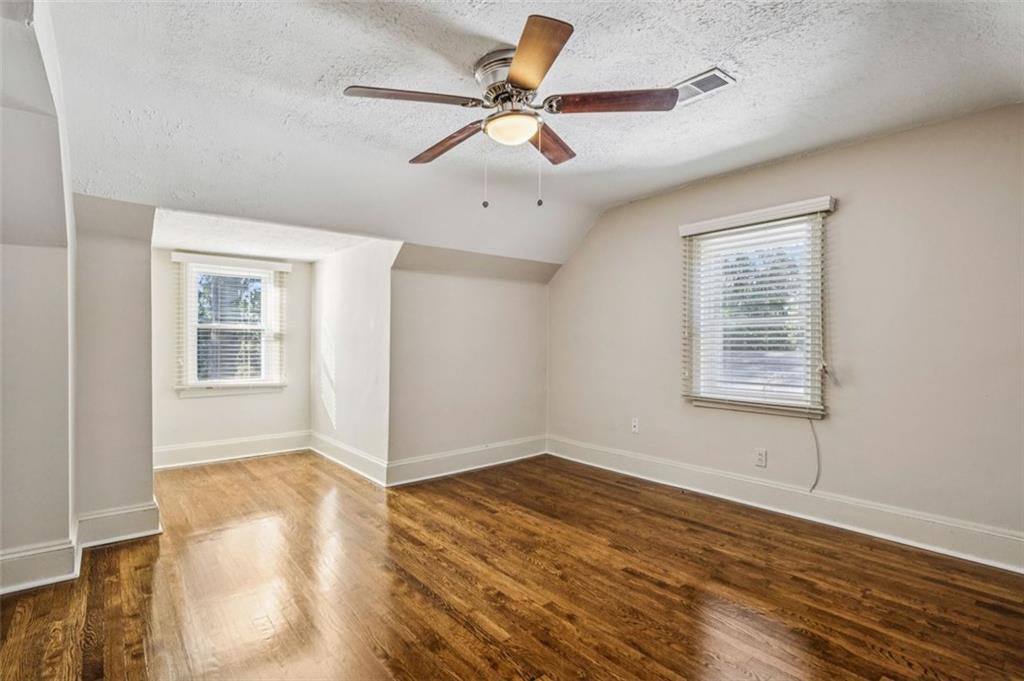 2050 Mercer Avenue Atlanta, GA 30337 - Photo 18 of 29 a view of an empty room with window and wooden floor