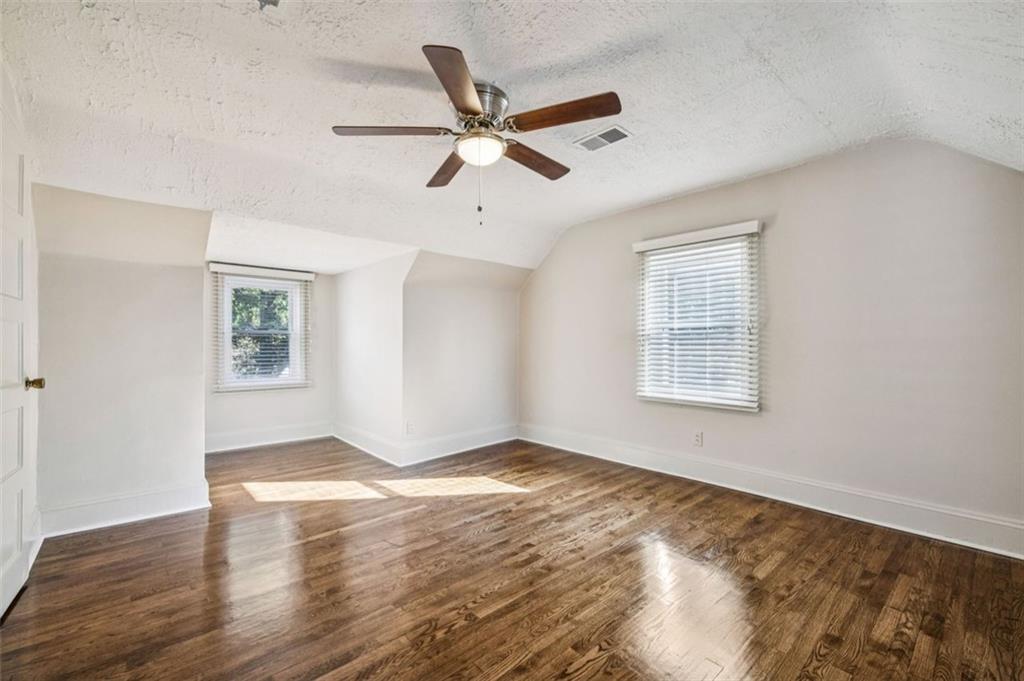 2050 Mercer Avenue Atlanta, GA 30337 - Photo 19 of 29 a view of an empty room with window and wooden floor