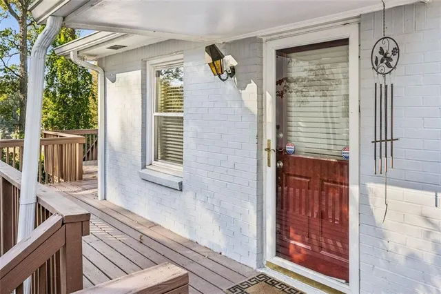 a view of a door and chair in the balcony