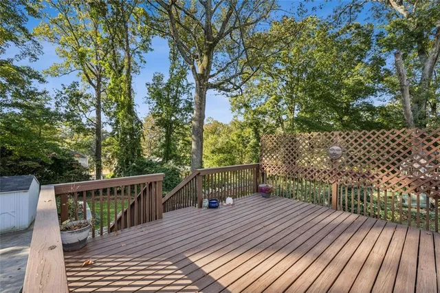 a balcony with wooden floor and fence