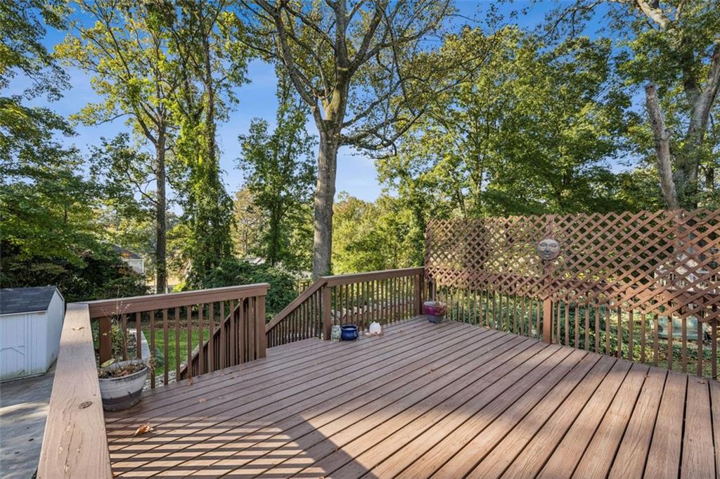 2050 Mercer Avenue Atlanta, GA 30337 - Photo 24 of 29 a balcony with wooden floor and fence