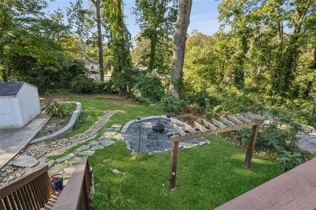 a view of a park with large trees