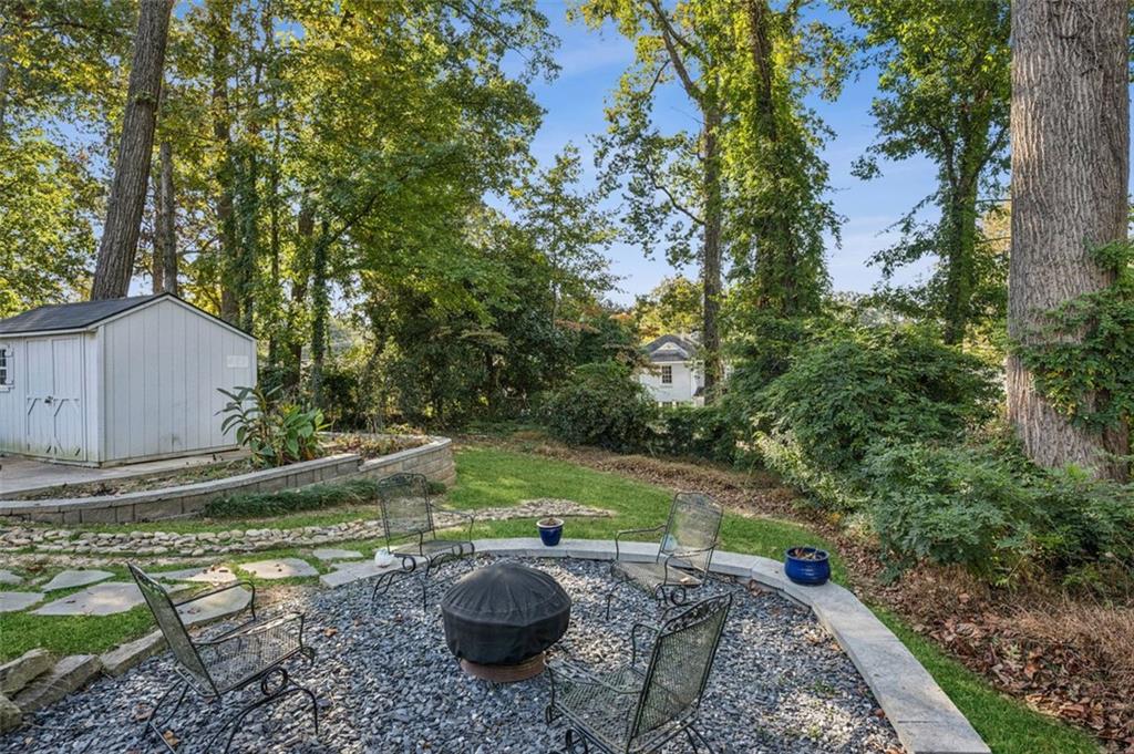 2050 Mercer Avenue Atlanta, GA 30337 - Photo 27 of 29 a backyard of a house with yard and trampoline