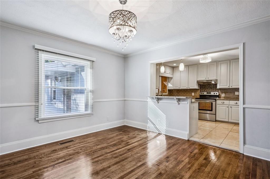 2050 Mercer Avenue Atlanta, GA 30337 - Photo 8 of 29 a kitchen with a refrigerator and a stove top oven