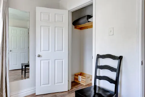 a bedroom with a bed and a closet