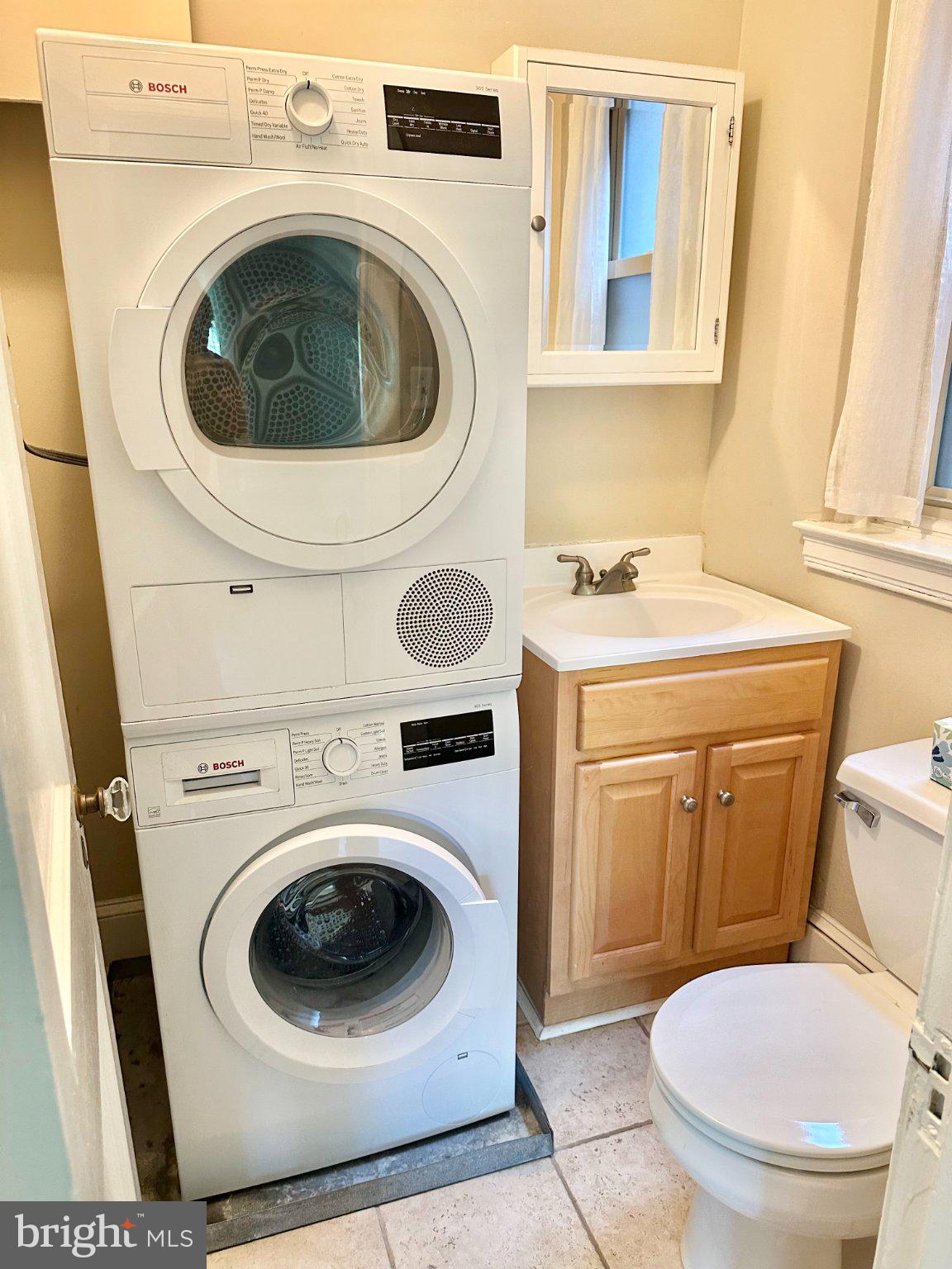 212 Idris Road, Unit F3 Merion Station, PA 19066 - Photo 18 of 25 Bosch washer/dryer (ventless!) in the powder room.