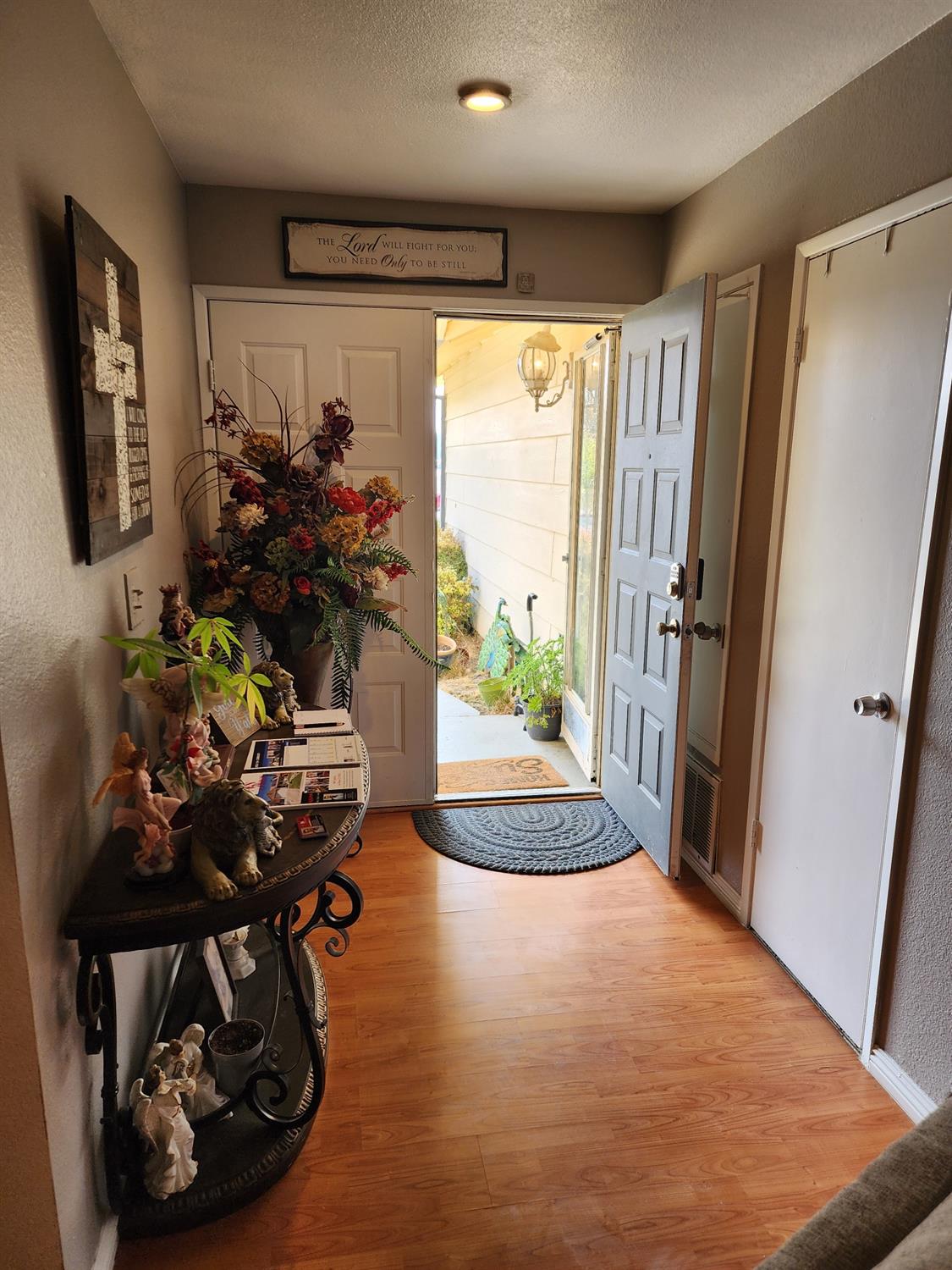 1406 Quail Street Los Banos, CA 93635 - Photo 13 of 18 a view of a entryway with wooden floor