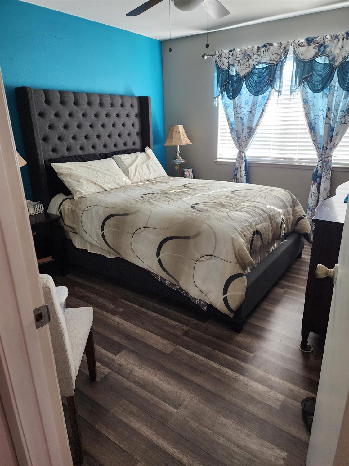 1406 Quail Street Los Banos, CA 93635 - Photo 15 of 18 a bedroom with bed and window