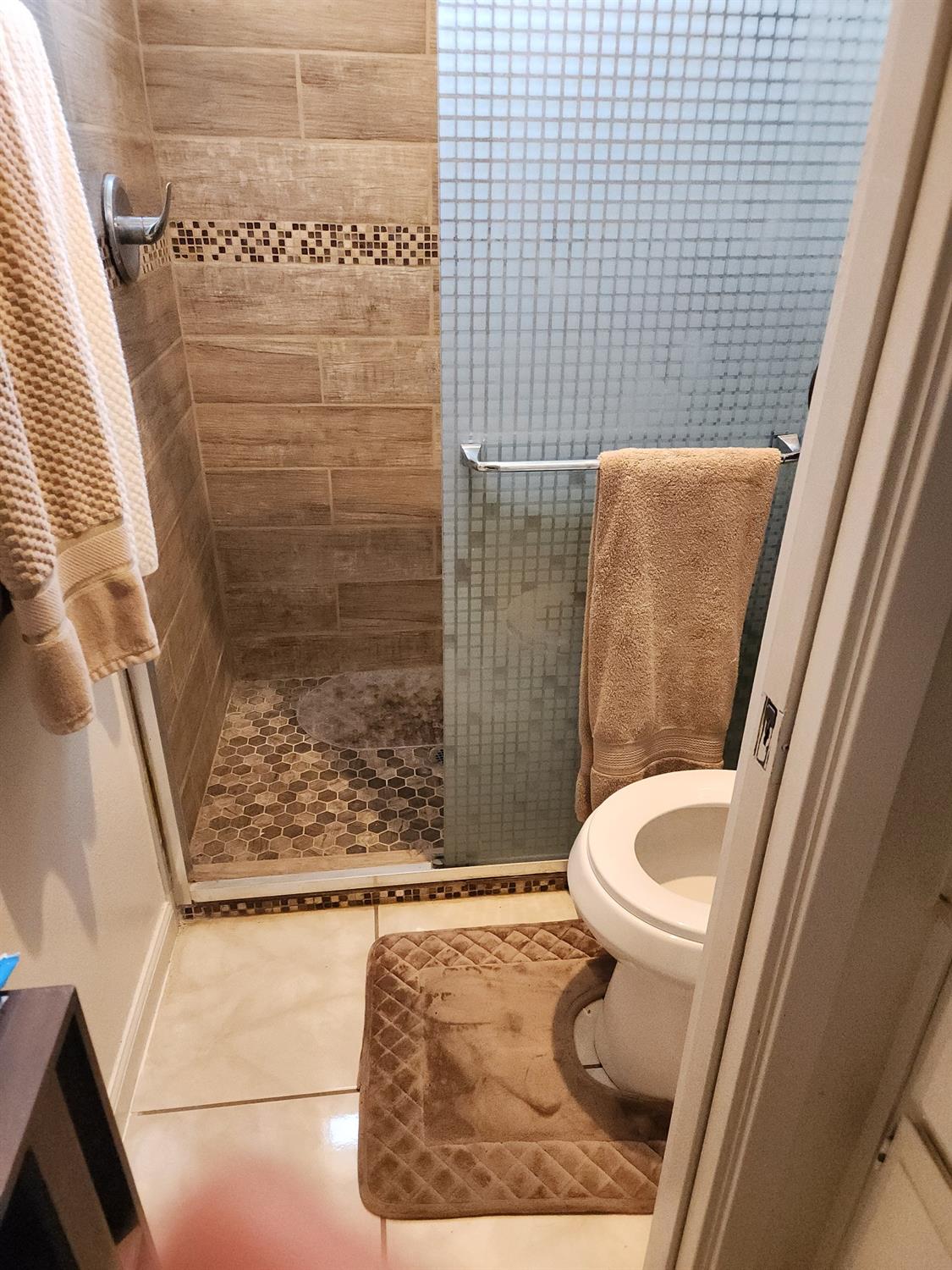 1406 Quail Street Los Banos, CA 93635 - Photo 10 of 18 a bathroom with a sink and toilet