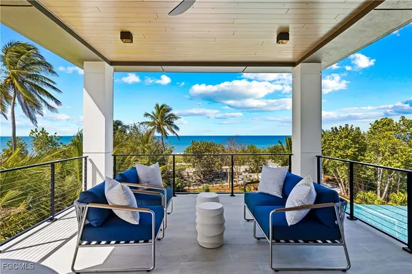 a view of a chairs and table in patio