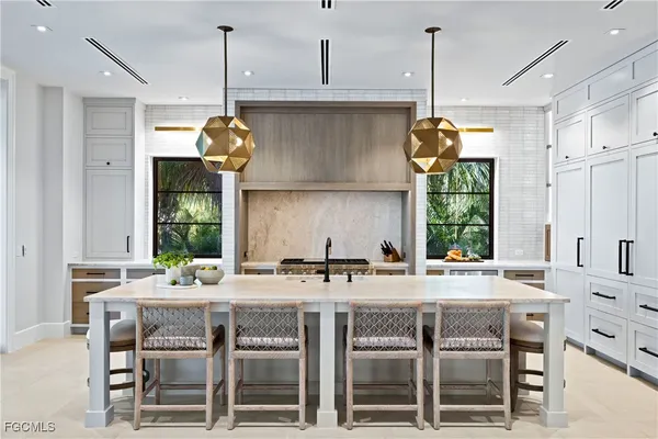 a kitchen with a center island and appliances