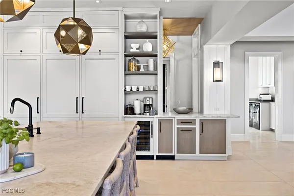 a kitchen with stainless steel appliances granite countertop a stove and cabinets