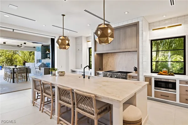 an open kitchen with a table and chairs in it