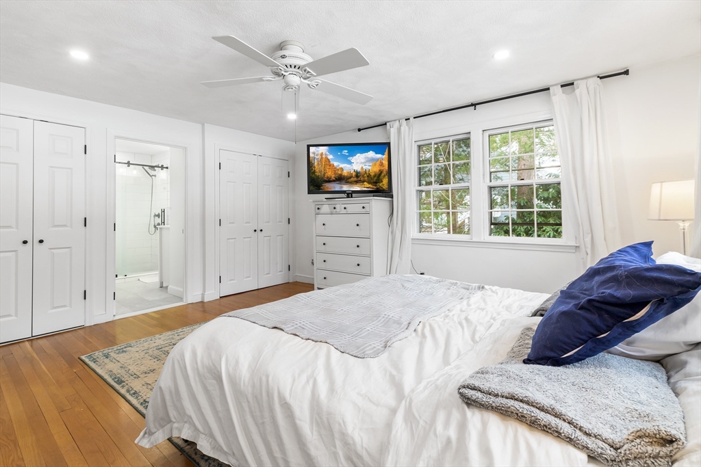 14 Griscom Road Sudbury, MA 01776 - Photo 11 of 32 a bedroom with a bed and a flat screen tv