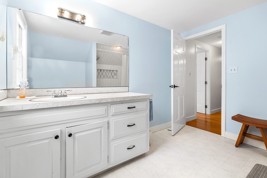 14 Griscom Road Sudbury, MA 01776 - Photo 18 of 32 a bathroom with a sink and a mirror