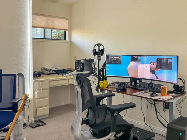 a view of a workspace with furniture