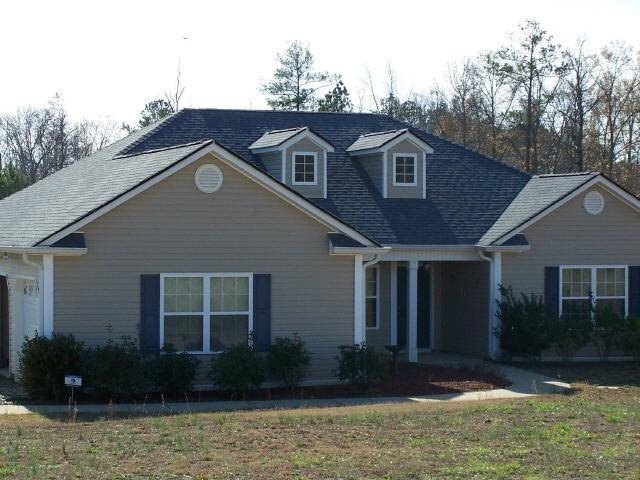 1621 Bates Road Concord, GA 30206 - Photo 1 of 1 a front view of a house with garden