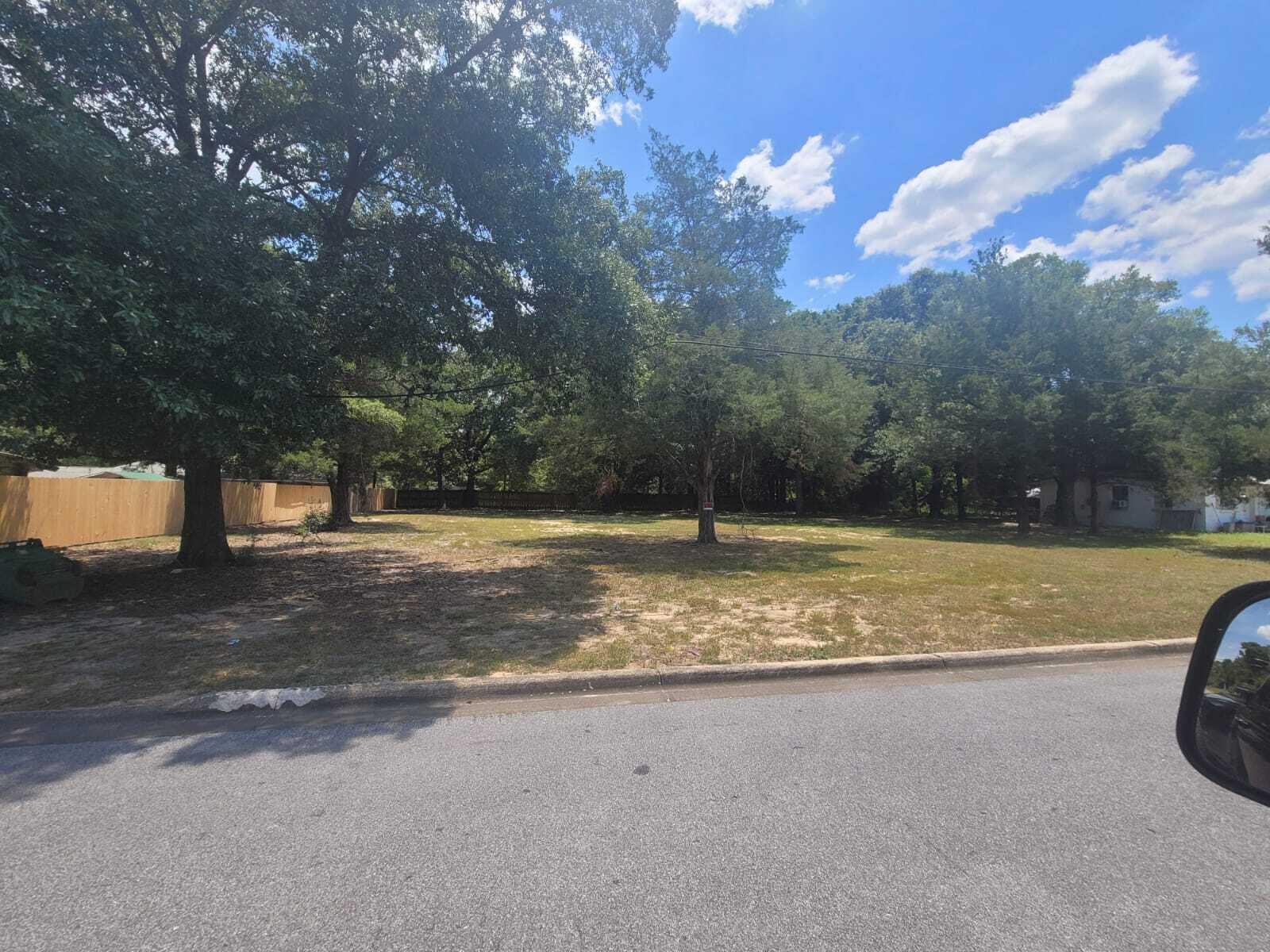 175 Mc Arthur Street Crestview, FL 32539 - Photo 2 of 3 a view of a yard with a house