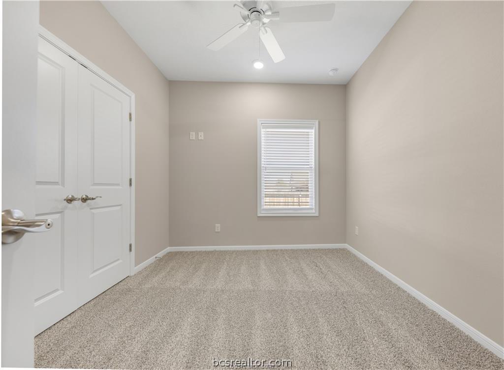 1249 Storm Row Lane Bryan, TX 77803 - Photo 16 of 20 a view of an empty room with a window