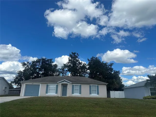 a view of house with yard