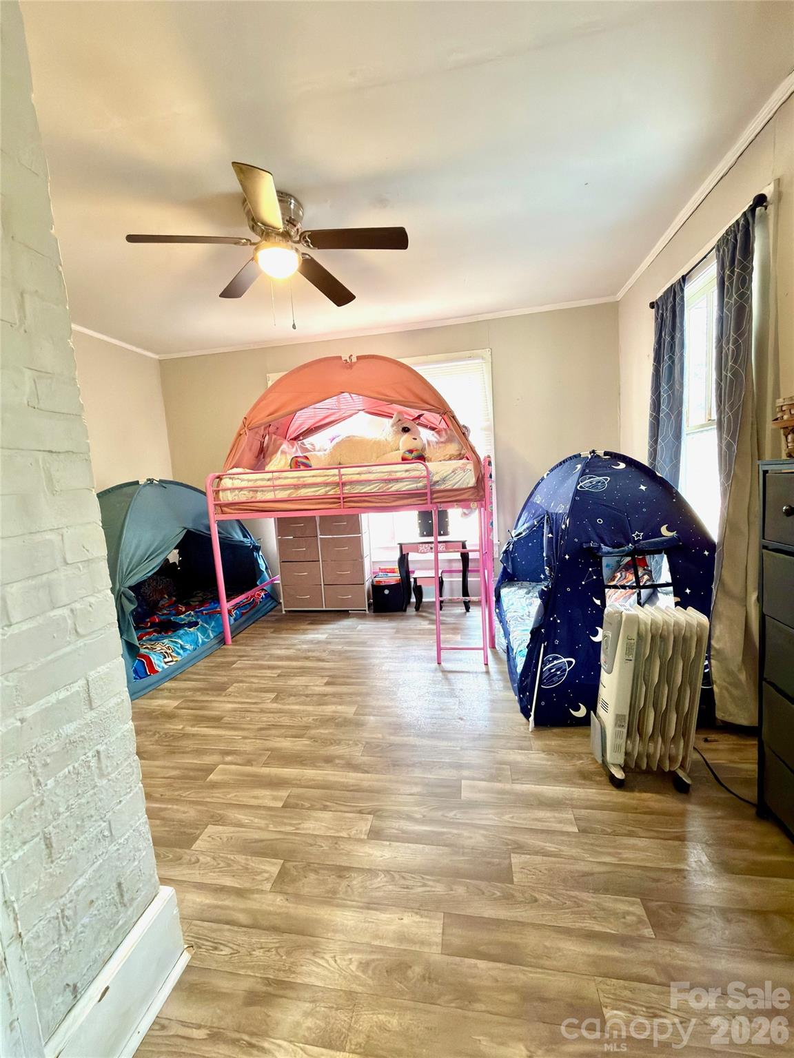 137 Clements Road Rutherfordton, NC 28139 - Photo 12 of 16 a living room with a bed and a chandelier