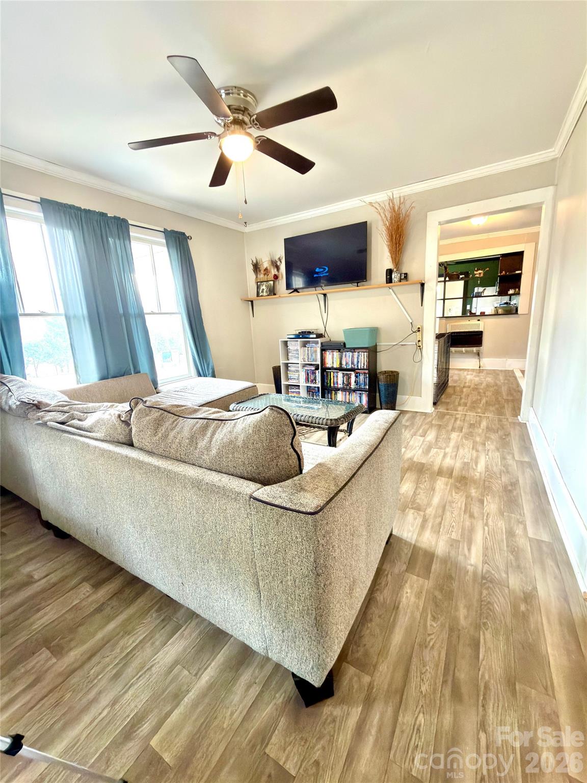 137 Clements Road Rutherfordton, NC 28139 - Photo 4 of 16 a living room with stainless steel appliances kitchen island granite countertop a sink a stove and a wooden floors