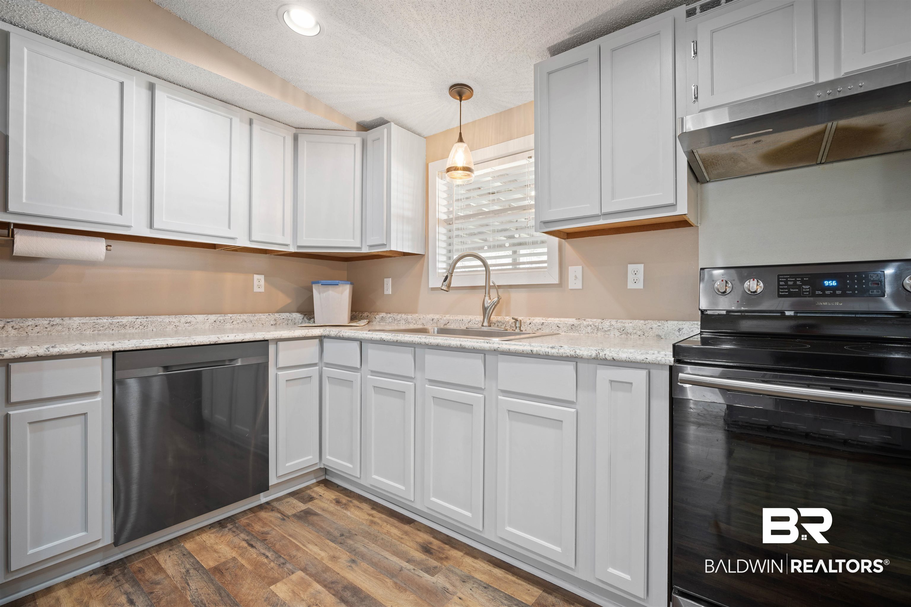 9011 Wilmer Georgetown Road Wilmer, AL 36587 - Photo 10 of 34 Kitchen featuring a sink, wood finished floors, dishwasher, exhaust hood, and range with electric cooktop