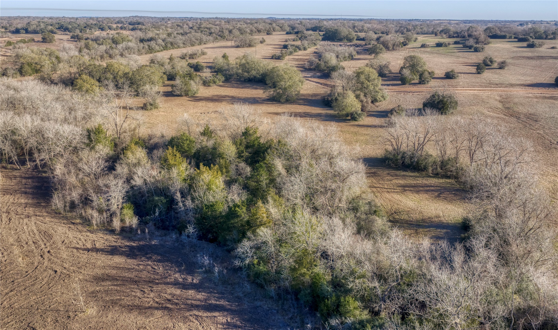 an aerial view of parked car with mountain view