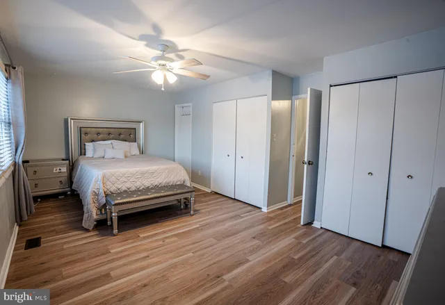 a spacious bedroom with a bed and a window