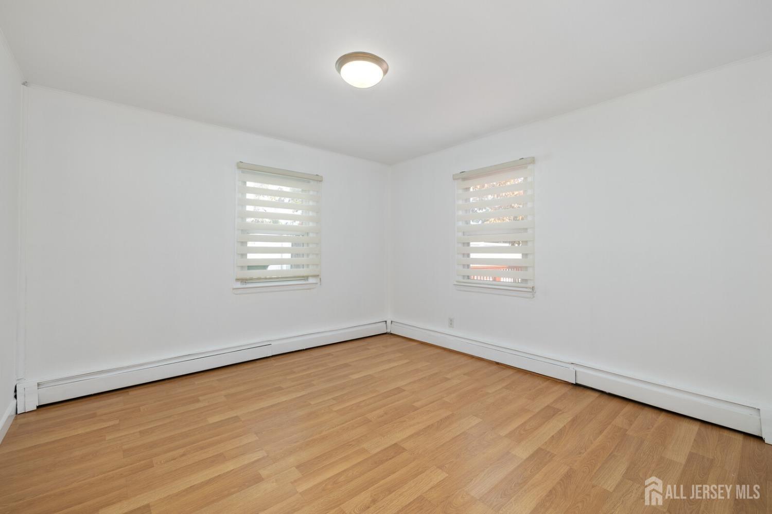 185 Plainfield Avenue Edison, NJ 08817 - Photo 13 of 30 an empty room with a window
