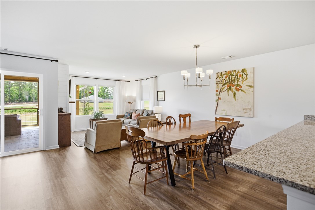 412 Chadwick Lane Walhalla, SC 29691 - Photo 9 of 37 This generous living and dining space showcases durable flooring and an abundance of natural light.