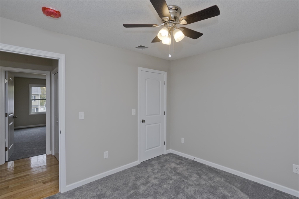 82 Judson Street Springfield, MA 01104 - Photo 23 of 38 wooden floor in an empty room