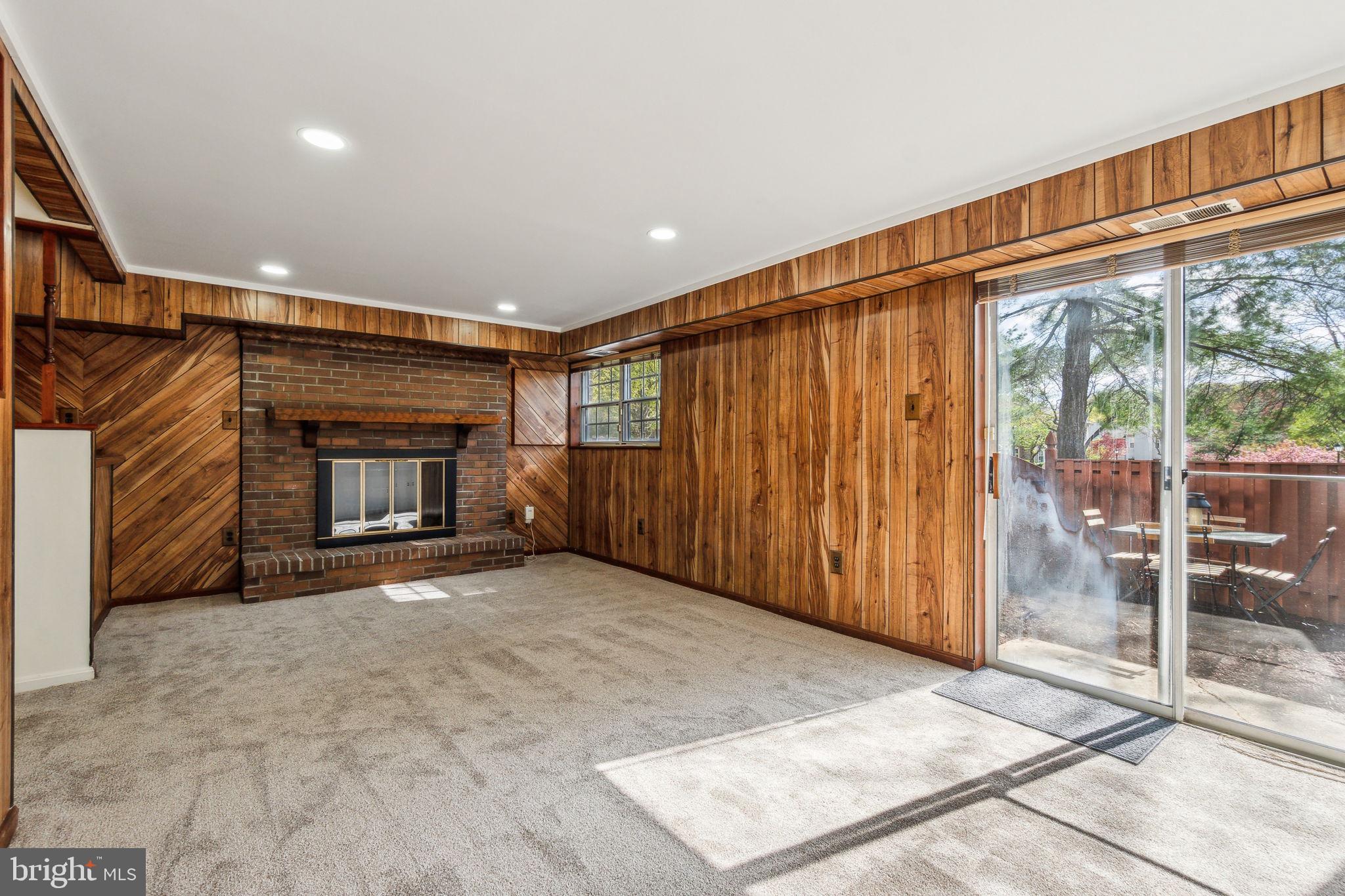 3715 Capulet Terrace, Unit 37154 Silver Spring, MD 20906 - Photo 42 of 53 Large, bright rec room w/ walk out & FP