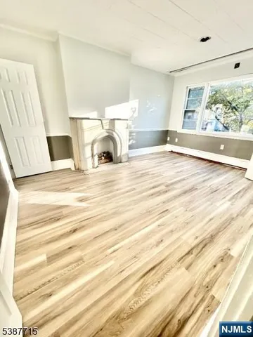 a view of living room with furniture and large window