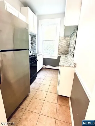 a view of kitchen with furniture and large window