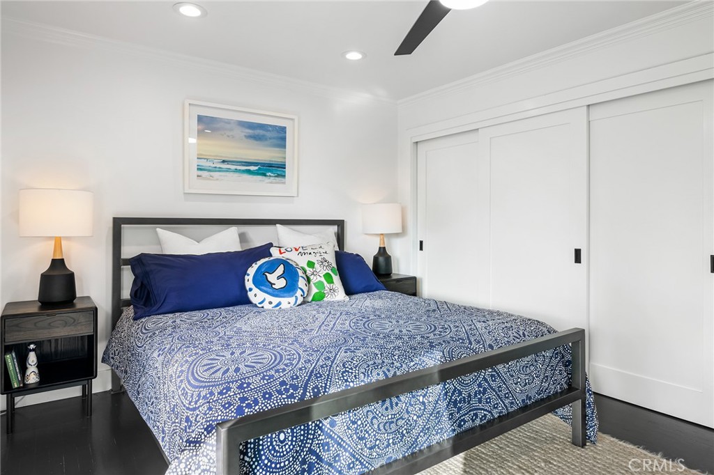 736 Griffith Place Laguna Beach, CA 92651 - Photo 17 of 24 a bedroom with a bed and painting on the wall