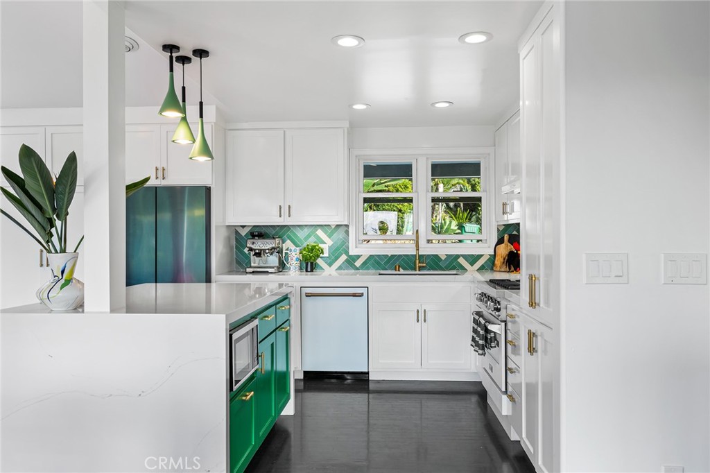 736 Griffith Place Laguna Beach, CA 92651 - Photo 5 of 24 a kitchen with white cabinets and window
