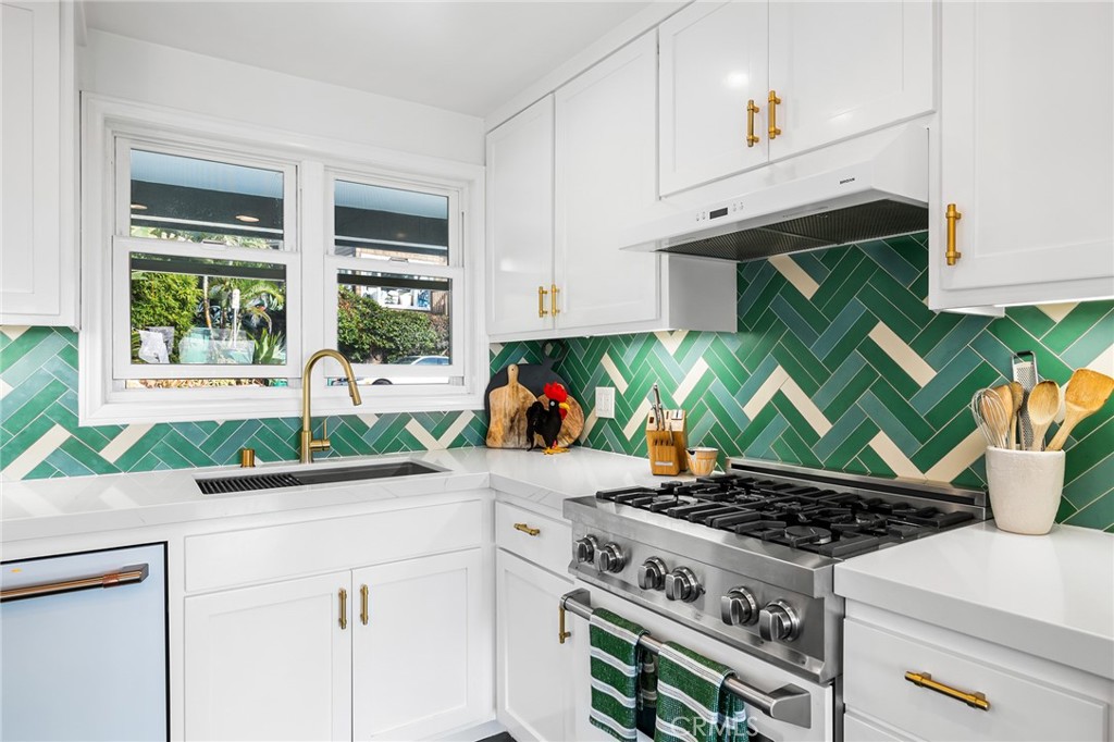 736 Griffith Place Laguna Beach, CA 92651 - Photo 6 of 24 a kitchen with a stove and a sink