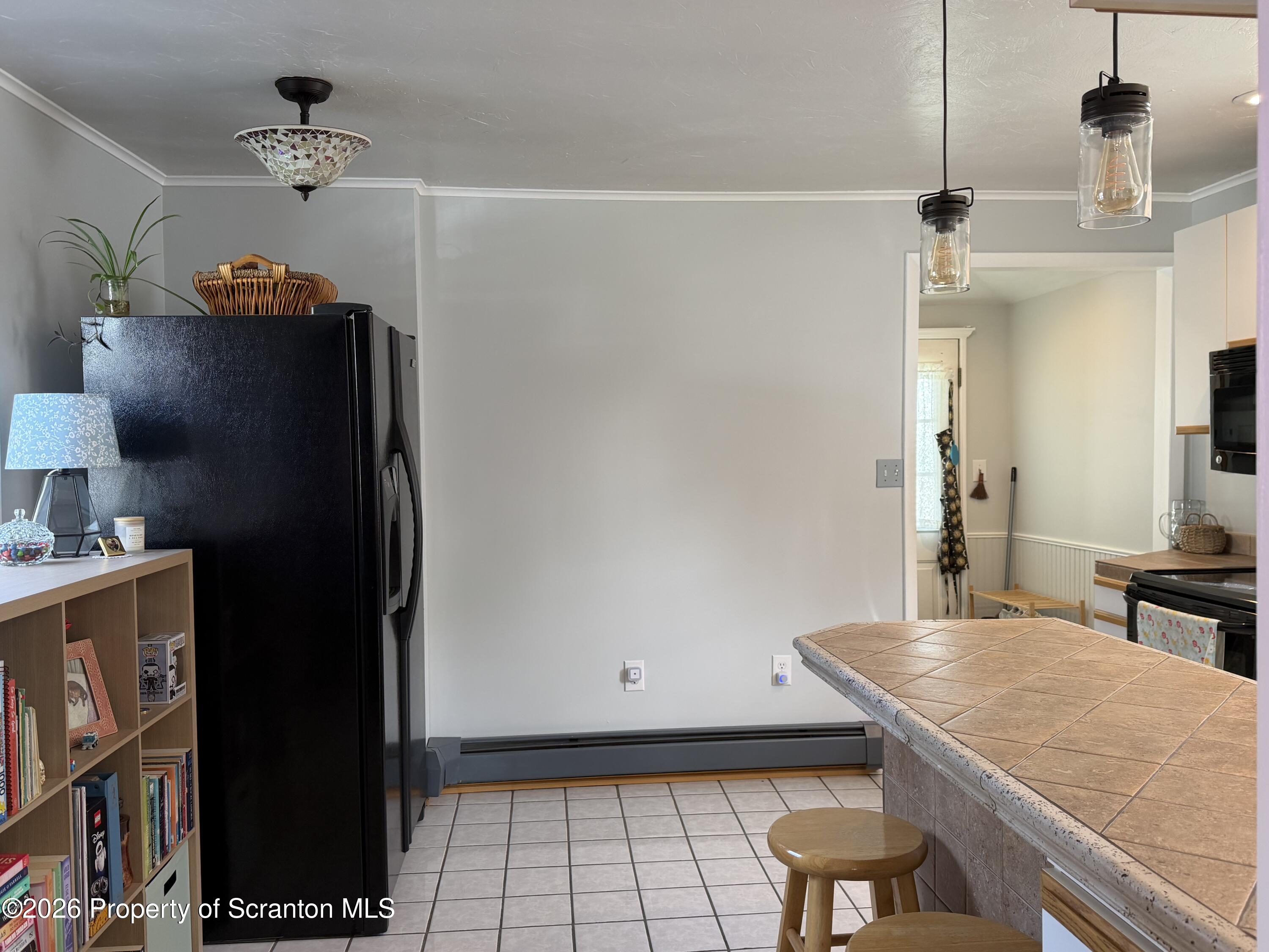 320 Haverly Street Throop, PA 18512 - Photo 8 of 27 a kitchen with a refrigerator and a stove