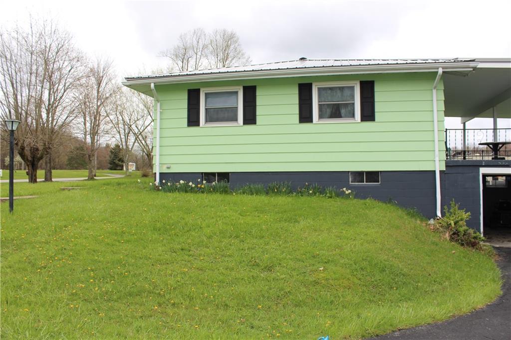 1287 Franklin Road Jackson Center, PA 16133 - Photo 18 of 21 a view of a house with a backyard