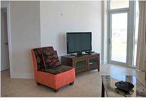 1110 Santa Rosa Boulevard, Unit B100 Fort Walton Beach, FL 32548 - Photo 16 of 27 a living room with furniture and a flat screen tv