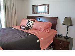 1110 Santa Rosa Boulevard, Unit B100 Fort Walton Beach, FL 32548 - Photo 17 of 27 a bedroom with a bed and a window