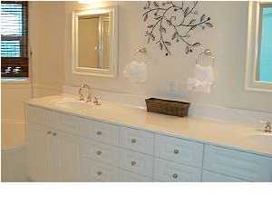 1110 Santa Rosa Boulevard, Unit B100 Fort Walton Beach, FL 32548 - Photo 19 of 27 a bathroom with a sink and a mirror