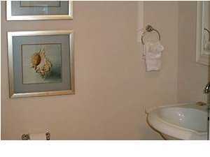 1110 Santa Rosa Boulevard, Unit B100 Fort Walton Beach, FL 32548 - Photo 26 of 27 a bathroom with a sink and a mirror