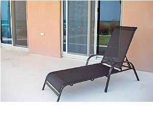 1110 Santa Rosa Boulevard, Unit B100 Fort Walton Beach, FL 32548 - Photo 10 of 27 a blue chair sitting in front of a window