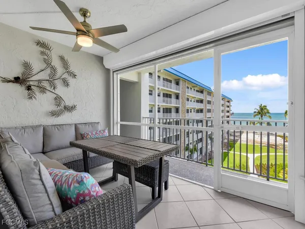 a view of a balcony with furniture
