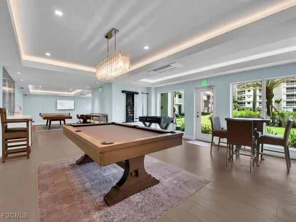 a room with lots of furniture and a table